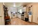 Efficient kitchen with white cabinetry, modern appliances, and tile flooring at 2127 Patrick St, Kissimmee, FL 34741