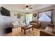 Bright living room featuring hardwood floors, comfortable sofas, and natural light at 2127 Patrick St, Kissimmee, FL 34741