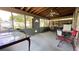 A screened in patio complete with an outdoor seating and tables at 2127 Patrick St, Kissimmee, FL 34741