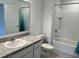 Well-maintained bathroom featuring a white vanity, shower-tub combo, and updated fixtures at 254 Mandovi St, Davenport, FL 33837