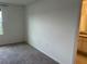 Neutral bedroom with plush carpeting adjacent to the bathroom area, offering convenience at 254 Mandovi St, Davenport, FL 33837