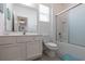 Bright bathroom with a shower-tub combination, white vanity, and a toilet at 2623 Calistoga Ave, Kissimmee, FL 34741