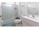 Well-lit bathroom featuring a shower, a vanity with a sink, and modern fixtures at 2623 Calistoga Ave, Kissimmee, FL 34741