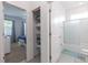 Bright, clean bathroom with a shower-tub combo and easy access to the adjacent bedroom at 2623 Calistoga Ave, Kissimmee, FL 34741