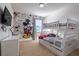 Playful bedroom featuring a Mickey Mouse comic themed mural and bunk beds at 2623 Calistoga Ave, Kissimmee, FL 34741