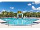 Stunning community pool surrounded by palm trees offers a luxurious resort-style experience at 2623 Calistoga Ave, Kissimmee, FL 34741