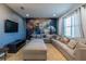 Entertainment room with movie theme, a large gray sectional, and a mural wall provides cozy atmosphere at 2623 Calistoga Ave, Kissimmee, FL 34741