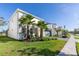 Attractive two-story home showcasing its manicured lawn and two palm trees at 2623 Calistoga Ave, Kissimmee, FL 34741