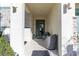 Inviting front porch with seating, offering a cozy and welcoming entrance to the home at 2623 Calistoga Ave, Kissimmee, FL 34741