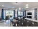 This open-concept kitchen boasts granite countertops, white cabinetry, and pendant lighting over the island at 2623 Calistoga Ave, Kissimmee, FL 34741