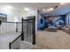 Upstairs loft space featuring a staircase and a movie themed living room at 2623 Calistoga Ave, Kissimmee, FL 34741
