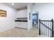 Bright loft area featuring a wet bar with white cabinetry and granite countertops at 2623 Calistoga Ave, Kissimmee, FL 34741
