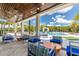 Inviting patio area with comfortable seating, perfect for relaxation by the community pool at 2623 Calistoga Ave, Kissimmee, FL 34741