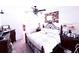 Cozy bedroom features a decorative wrought iron bed frame and a ceiling fan at 2919 Woodward Ln, Winter Haven, FL 33884