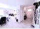 Inviting entryway and dining area that leads into a modern kitchen with an eat-in island at 2919 Woodward Ln, Winter Haven, FL 33884