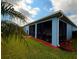 Spacious screened-in lanai with ample seating, providing an inviting outdoor living space at 2919 Woodward Ln, Winter Haven, FL 33884