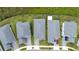 Aerial view of gray-roofed homes, showcasing well-kept lawns, paver driveways, and a neatly arranged neighborhood at 3052 Prelude Ln, Kissimmee, FL 34746