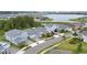 Aerial view of a residential community with a lake view on a sunny day at 3052 Prelude Ln, Kissimmee, FL 34746