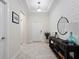 Foyer with neutral walls, tile floors, console table, and decorative mirror at 3052 Prelude Ln, Kissimmee, FL 34746