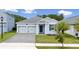 Delightful one-story home boasting a two-car garage, neat landscaping, and a stylish front entrance at 3052 Prelude Ln, Kissimmee, FL 34746
