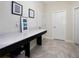 Bright mudroom with a long countertop, storage space, and neutral tones, offering functionality and style at 3052 Prelude Ln, Kissimmee, FL 34746