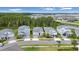 Street view of well-maintained homes with neat landscaping and paved driveways at 3052 Prelude Ln, Kissimmee, FL 34746