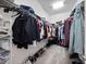Spacious walk-in closet with ample storage and organized shelving at 3052 Prelude Ln, Kissimmee, FL 34746