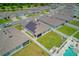 Aerial view of the neighborhood home featuring a pool and solar panels at 3062 Royal Tern Dr, Winter Haven, FL 33881