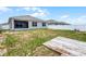 Wide backyard featuring a partial lawn, patio, and white vinyl fence at 3062 Royal Tern Dr, Winter Haven, FL 33881
