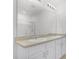 Bathroom vanity featuring double sinks, granite countertop, and a large mirror at 3062 Royal Tern Dr, Winter Haven, FL 33881