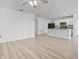 Open-concept layout connecting the living area to the kitchen, featuring wood-look floors and plenty of space at 3062 Royal Tern Dr, Winter Haven, FL 33881