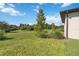 Expansive backyard featuring lush lawn and mature landscaping, offering privacy and space for outdoor activities at 3224 Oxbow Ct, Harmony, FL 34773