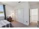 Comfortable bedroom featuring a bed with a stylish lamp and a closet for storage, ideal for relaxation at 3224 Oxbow Ct, Harmony, FL 34773
