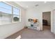 Bright bedroom with a large window, showcasing a fun storage unit with toys, and neutral carpet at 3224 Oxbow Ct, Harmony, FL 34773