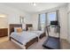 Bedroom with twin beds, wood headboards, and a treadmill, with an ensuite bathroom at 3224 Oxbow Ct, Harmony, FL 34773