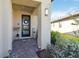 Inviting front porch with decorative wreath and well-maintained landscaping at 3224 Oxbow Ct, Harmony, FL 34773
