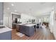 Open-concept kitchen with stainless steel appliances and a central island at 3224 Oxbow Ct, Harmony, FL 34773