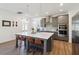 Stylish kitchen with a large island, modern lighting, and ample cabinet space at 3224 Oxbow Ct, Harmony, FL 34773