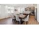 Open-concept kitchen with gray cabinets, a center island, and stainless steel appliances at 3224 Oxbow Ct, Harmony, FL 34773