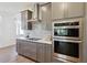 Modern kitchen with stainless steel appliances and mosaic backsplash at 3224 Oxbow Ct, Harmony, FL 34773