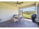 Relaxing screened-in patio featuring comfortable seating and scenic backyard views, perfect for outdoor dining at 3224 Oxbow Ct, Harmony, FL 34773
