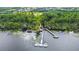 Aerial view of a private dock on the lake within the Harmony community at 3420 Middlebrook Pl, Harmony, FL 34773