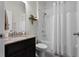 Cozy bathroom featuring a tub with shower, granite countertop, and decorative accents at 3420 Middlebrook Pl, Harmony, FL 34773
