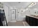 Well-lit bathroom featuring a walk-in shower, soaking tub, and double sink vanity at 3420 Middlebrook Pl, Harmony, FL 34773
