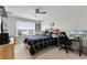 Bedroom featuring a bed, a desk and natural light from the window at 3420 Middlebrook Pl, Harmony, FL 34773