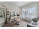 Bright bedroom featuring a makeup vanity, elegant decor, and natural light from the window at 3420 Middlebrook Pl, Harmony, FL 34773