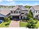 Charming two-story home showcasing a brick driveway and solar panels at 3420 Middlebrook Pl, Harmony, FL 34773
