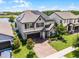 Beautiful two-story home boasting a brick driveway and solar panels at 3420 Middlebrook Pl, Harmony, FL 34773