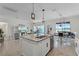 Open-concept kitchen and dining area with a kitchen island, stainless steel appliances, and recessed lighting at 3420 Middlebrook Pl, Harmony, FL 34773