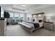 Spacious main bedroom with a sitting area, tray ceiling, and an abundance of natural light at 3420 Middlebrook Pl, Harmony, FL 34773